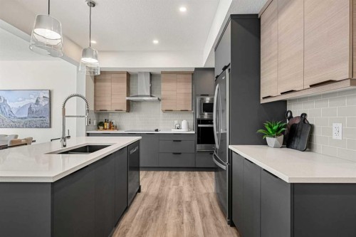 121 Quartz Crescent, Cochrane, AB - Indoor Photo Showing Kitchen With Upgraded Kitchen