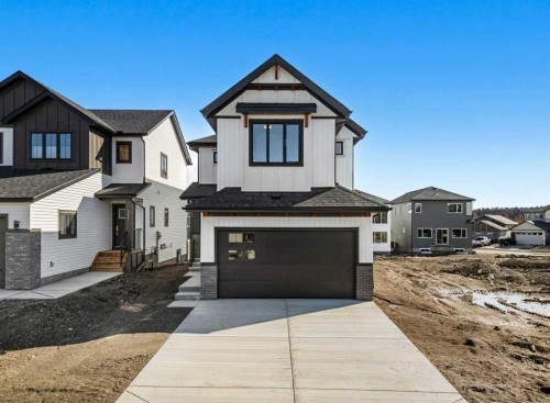 121 Quartz Crescent, Cochrane, AB - Outdoor With Facade