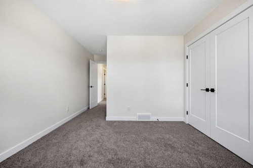 121 Quartz Crescent, Cochrane, AB - Indoor Photo Showing Other Room