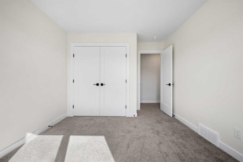 121 Quartz Crescent, Cochrane, AB - Indoor Photo Showing Other Room