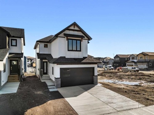 121 Quartz Crescent, Cochrane, AB - Outdoor With Facade