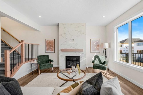121 Quartz Crescent, Cochrane, AB - Indoor Photo Showing Living Room With Fireplace