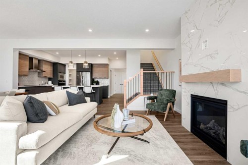 121 Quartz Crescent, Cochrane, AB - Indoor Photo Showing Living Room With Fireplace