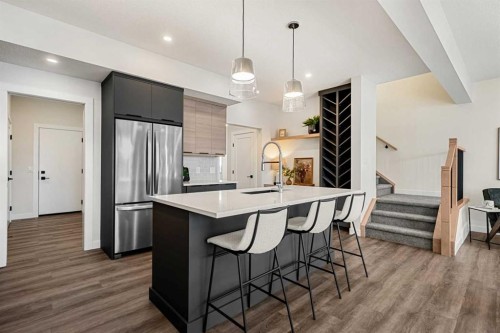 121 Quartz Crescent, Cochrane, AB - Indoor Photo Showing Kitchen With Upgraded Kitchen