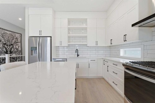 56 Iris Crescent, Okotoks, AB - Indoor Photo Showing Kitchen With Upgraded Kitchen