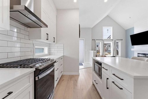 56 Iris Crescent, Okotoks, AB - Indoor Photo Showing Kitchen With Upgraded Kitchen