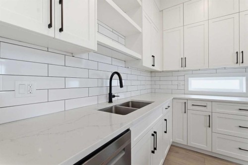 56 Iris Crescent, Okotoks, AB - Indoor Photo Showing Kitchen With Double Sink With Upgraded Kitchen