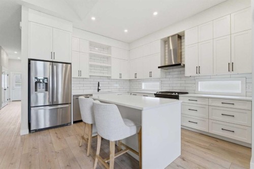 56 Iris Crescent, Okotoks, AB - Indoor Photo Showing Kitchen With Upgraded Kitchen