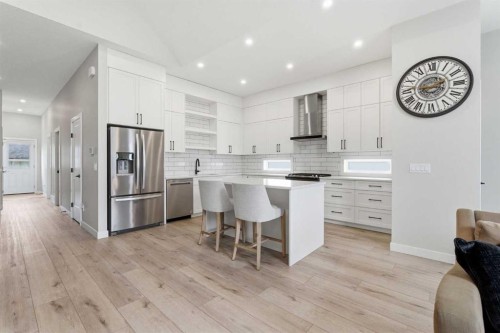 56 Iris Crescent, Okotoks, AB - Indoor Photo Showing Kitchen With Upgraded Kitchen