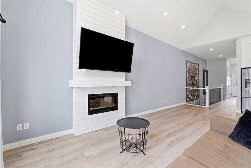 56 Iris Crescent, Okotoks, AB - Indoor Photo Showing Living Room With Fireplace
