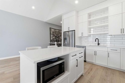 56 Iris Crescent, Okotoks, AB - Indoor Photo Showing Kitchen With Upgraded Kitchen