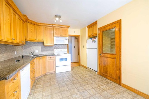 59 Rosewood Road Nw, Calgary, AB - Indoor Photo Showing Kitchen With Double Sink