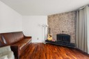 214 Huntington Close Ne, Calgary, AB  - Indoor Photo Showing Living Room With Fireplace 
