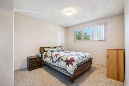 153 Mckinnon Crescent Ne, Calgary, AB - Indoor Photo Showing Bedroom
