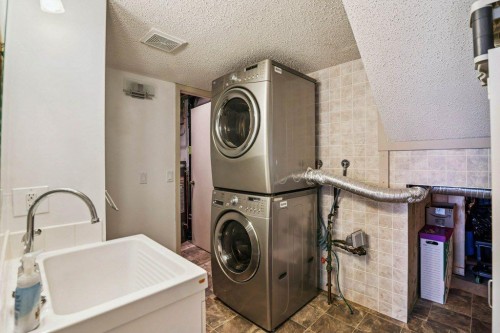 153 Mckinnon Crescent Ne, Calgary, AB - Indoor Photo Showing Laundry Room