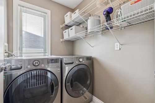 155 Somme Manor Sw, Calgary, AB - Indoor Photo Showing Laundry Room