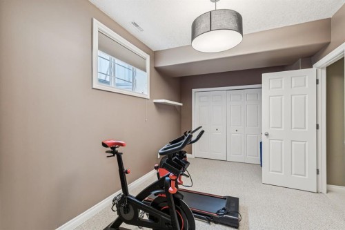155 Somme Manor Sw, Calgary, AB - Indoor Photo Showing Gym Room