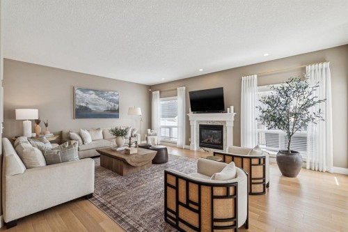 155 Somme Manor Sw, Calgary, AB - Indoor Photo Showing Living Room With Fireplace