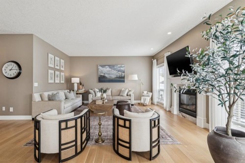 155 Somme Manor Sw, Calgary, AB - Indoor Photo Showing Living Room With Fireplace