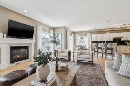 155 Somme Manor Sw, Calgary, AB - Indoor Photo Showing Living Room With Fireplace