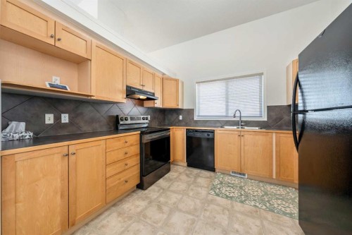 1211 Everridge Drive Sw, Calgary, AB - Indoor Photo Showing Kitchen With Double Sink