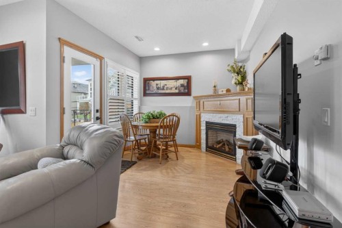 129 Bridlecreek Green Sw, Calgary, AB - Indoor Photo Showing Living Room With Fireplace