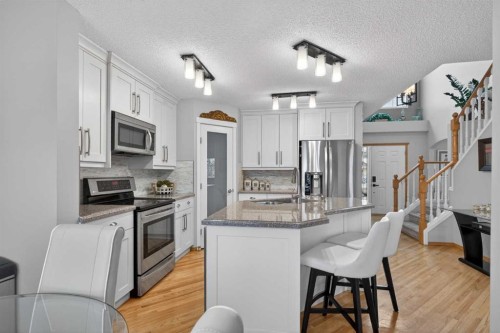 129 Bridlecreek Green Sw, Calgary, AB - Indoor Photo Showing Kitchen With Double Sink With Upgraded Kitchen