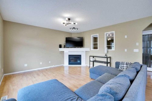 356 Chaparral Drive Se, Calgary, AB - Indoor Photo Showing Living Room With Fireplace