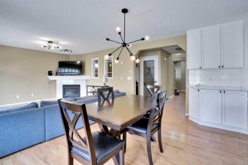 356 Chaparral Drive Se, Calgary, AB - Indoor Photo Showing Dining Room With Fireplace