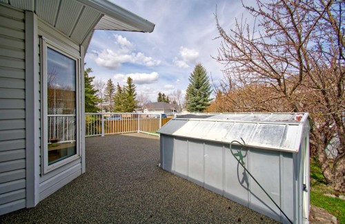 273 Woodside Road Nw, Airdrie, AB - Outdoor With Above Ground Pool