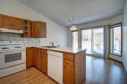 273 Woodside Road Nw, Airdrie, AB - Indoor Photo Showing Kitchen With Double Sink