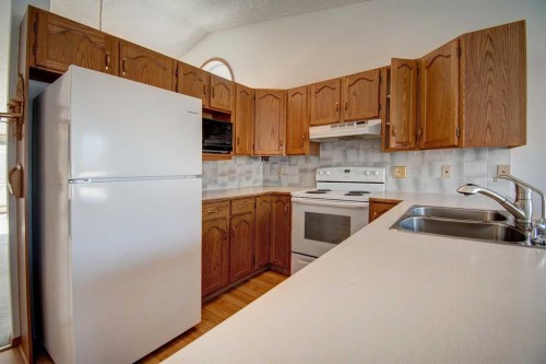 273 Woodside Road Nw, Airdrie, AB - Indoor Photo Showing Kitchen With Double Sink