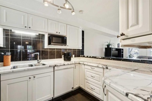 37 Ranch Glen Drive Nw, Calgary, AB - Indoor Photo Showing Kitchen With Double Sink