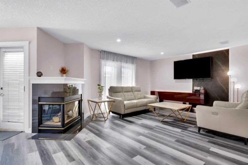 6 Douglas Woods Bay Se, Calgary, AB - Indoor Photo Showing Living Room With Fireplace
