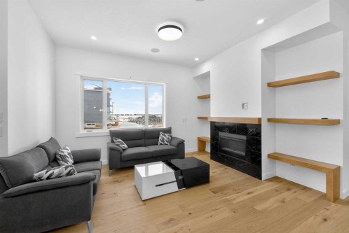 1049 Waterstone Green, Chestermere, AB - Indoor Photo Showing Living Room With Fireplace