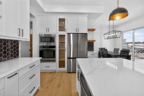 1049 Waterstone Green, Chestermere, AB - Indoor Photo Showing Kitchen With Upgraded Kitchen