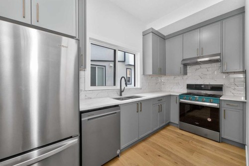 1049 Waterstone Green, Chestermere, AB - Indoor Photo Showing Kitchen With Double Sink With Upgraded Kitchen