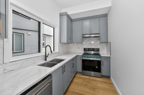 1049 Waterstone Green, Chestermere, AB - Indoor Photo Showing Kitchen With Double Sink
