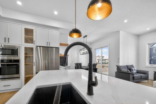 1049 Waterstone Green, Chestermere, AB - Indoor Photo Showing Kitchen With Double Sink With Upgraded Kitchen