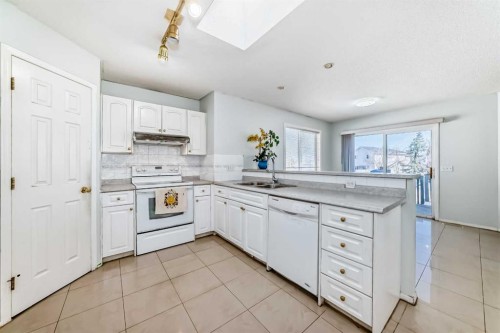 22 Applestone Park Se, Calgary, AB - Indoor Photo Showing Kitchen With Double Sink