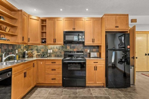 108 Casale Place, Canmore, AB - Indoor Photo Showing Kitchen With Double Sink