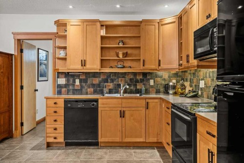 108 Casale Place, Canmore, AB - Indoor Photo Showing Kitchen With Double Sink