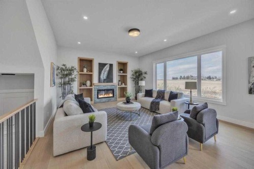 384 Watercrest Place, Chestermere, AB - Indoor Photo Showing Living Room With Fireplace