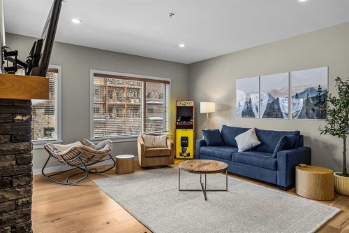 200-707 Spring Creek Drive, Canmore, AB - Indoor Photo Showing Living Room
