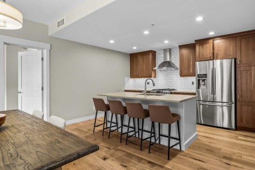 200-707 Spring Creek Drive, Canmore, AB - Indoor Photo Showing Kitchen With Upgraded Kitchen