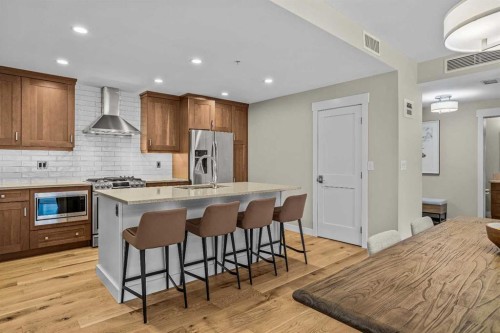 200-707 Spring Creek Drive, Canmore, AB - Indoor Photo Showing Kitchen With Upgraded Kitchen