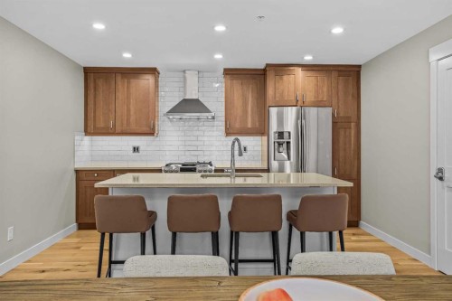 200-707 Spring Creek Drive, Canmore, AB - Indoor Photo Showing Kitchen With Upgraded Kitchen