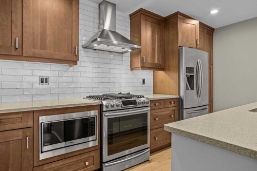 200-707 Spring Creek Drive, Canmore, AB - Indoor Photo Showing Kitchen With Upgraded Kitchen