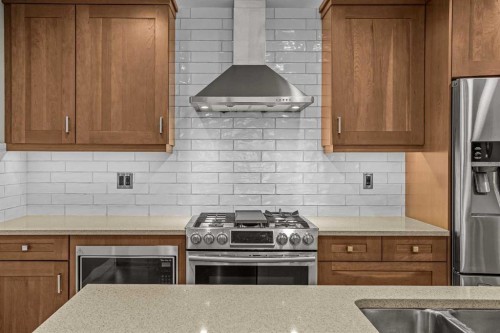 200-707 Spring Creek Drive, Canmore, AB - Indoor Photo Showing Kitchen With Double Sink