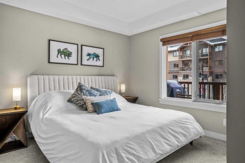 200-707 Spring Creek Drive, Canmore, AB - Indoor Photo Showing Bedroom